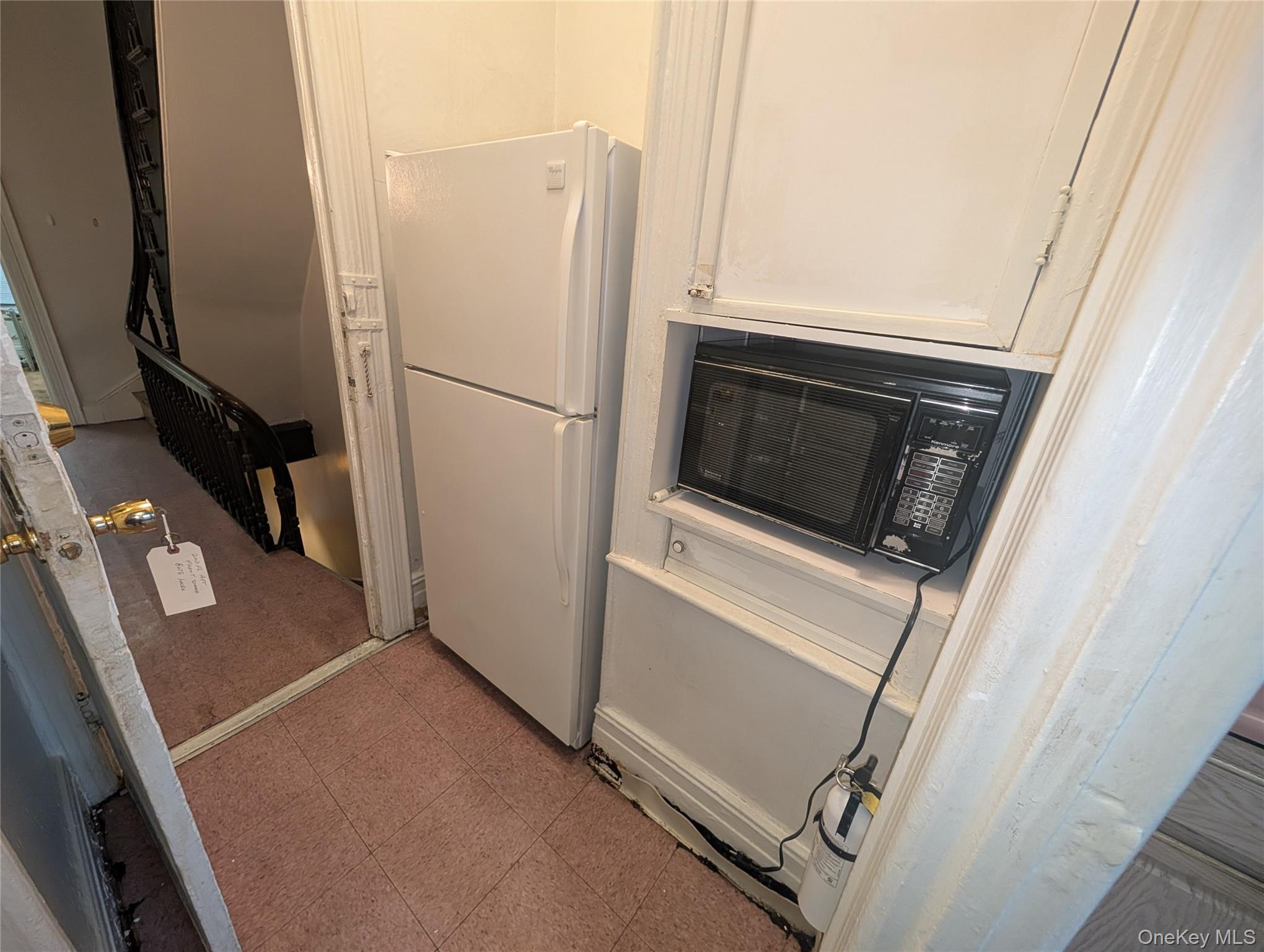 44-66 23rd Street Queens, NY 11101 - Photo 13 of 26 a view of a storage and utility room with washer and dryer