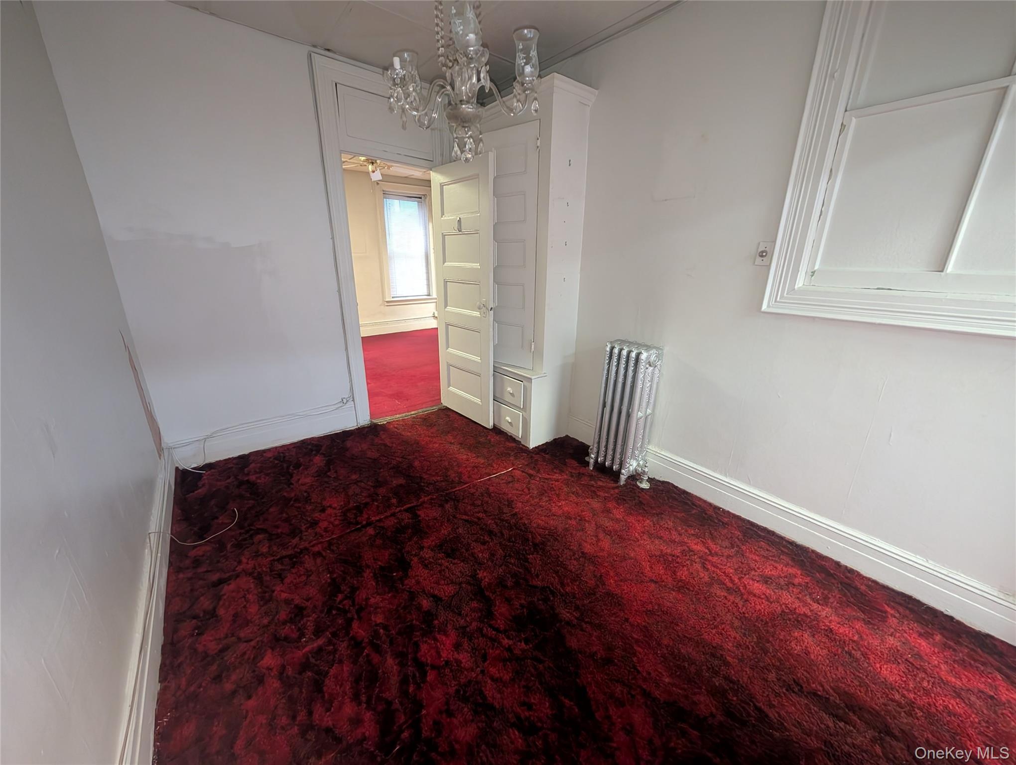 44-66 23rd Street Queens, NY 11101 - Photo 17 of 26 a bedroom with bed and window