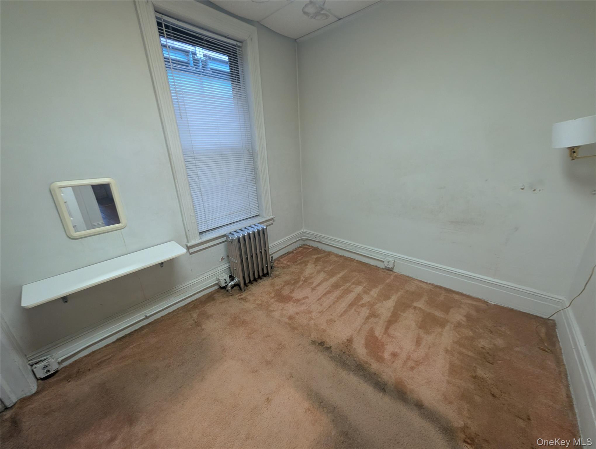 44-66 23rd Street Queens, NY 11101 - Photo 18 of 26 an empty room with windows