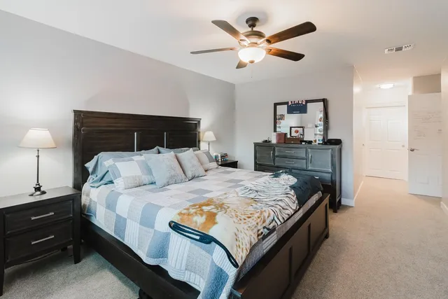 a white toilet sitting next to a bathroom sink
