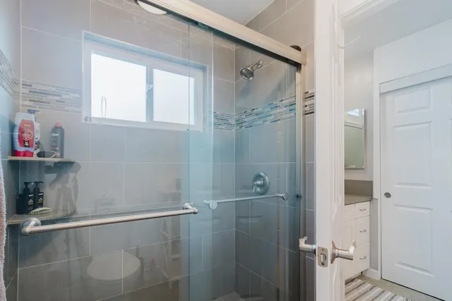 a dining room with furniture and a window