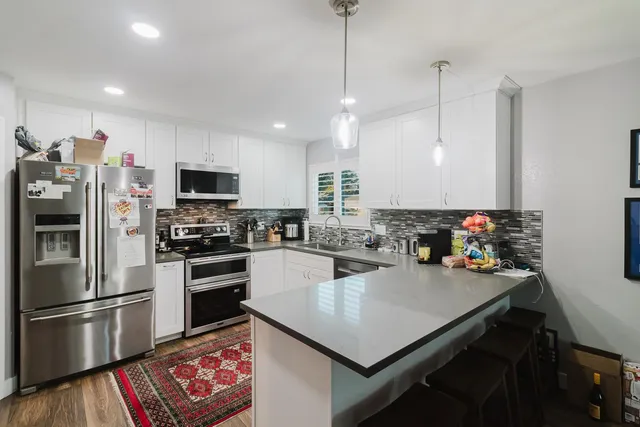 a view of backyard with sitting area