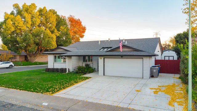 an aerial view of a house with a yard and a garden