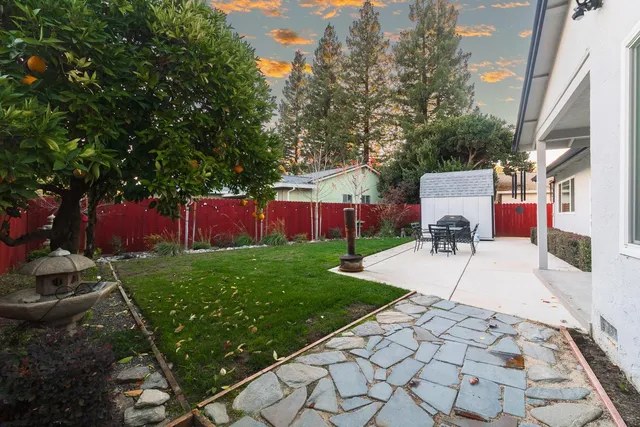 a view of backyard with sitting area