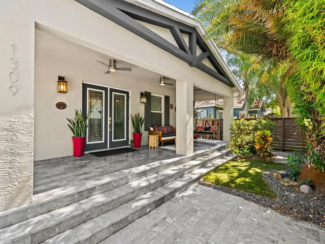 a view of a house with backyard and porch