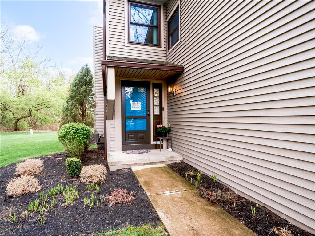 88 Devonshire Circle Penfield, NY 14526 - Photo 2 of 36 Your front porch with a perennial garden.