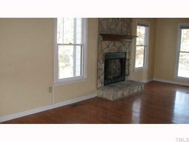 4225 Bluewing Road Raleigh, NC 27616 - Photo 5 of 8 a black and white photo of a living room