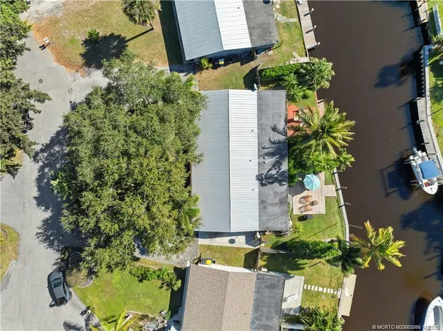an aerial view of a house with a yard and a garden