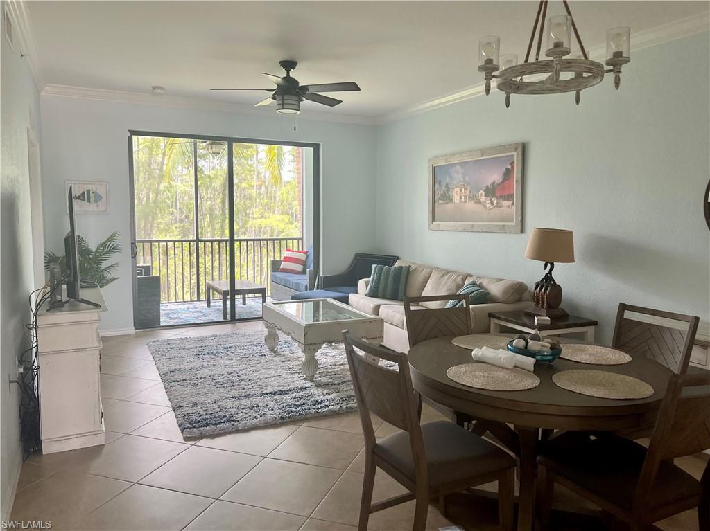9715 Acqua Court, Unit 125 Naples, FL 34113 - Photo 6 of 24 a living room with furniture and a window
