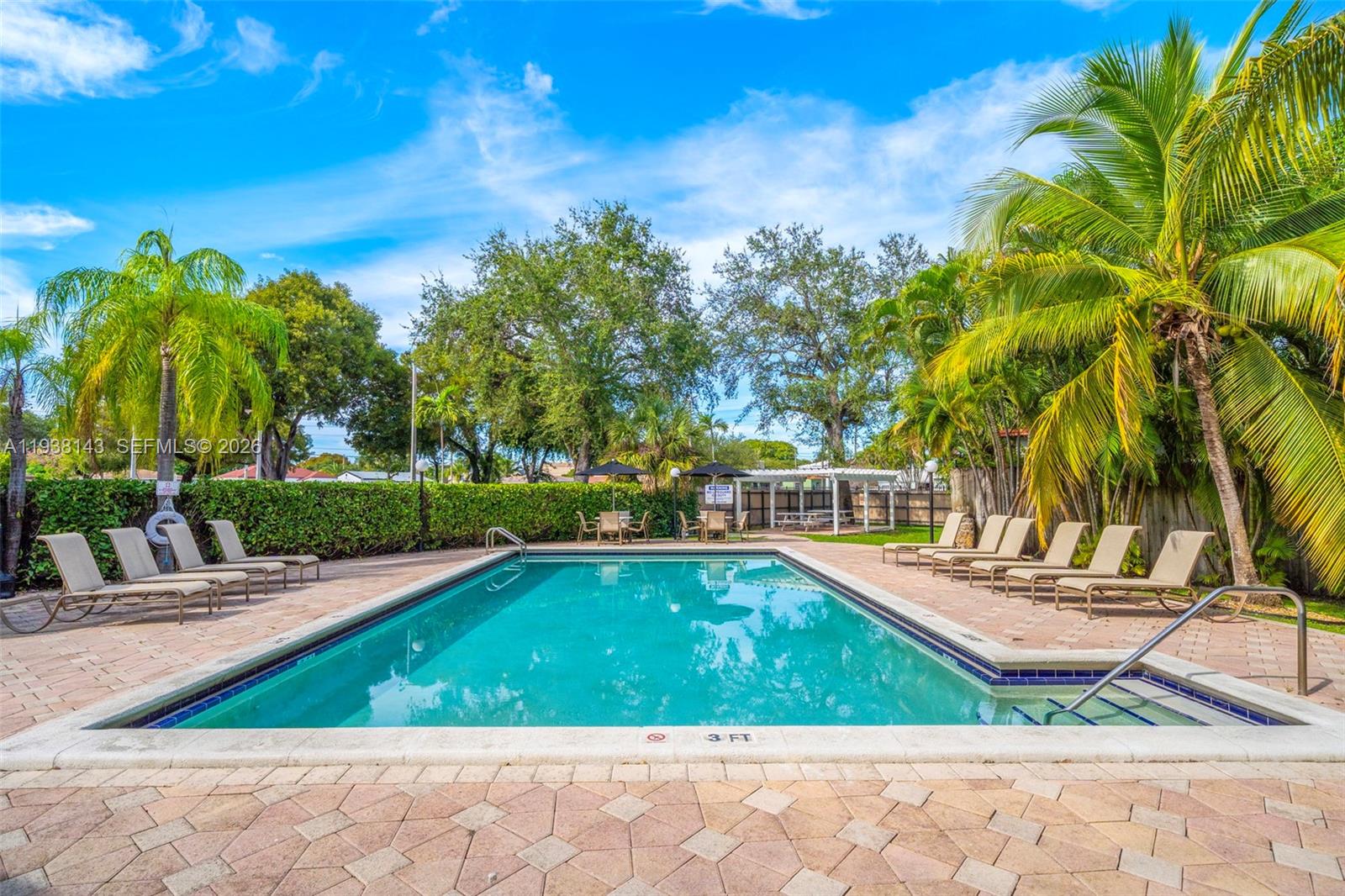 2150 Southwest 16th Avenue, Unit 402 Miami, FL 33145 - Photo 18 of 25 a view of a swimming pool with a patio
