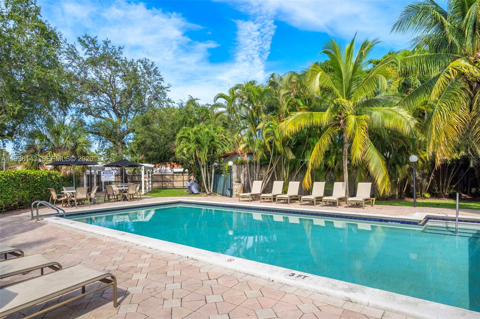 2150 Southwest 16th Avenue, Unit 402 Miami, FL 33145 - Photo 19 of 25 a view of swimming pool with a yard