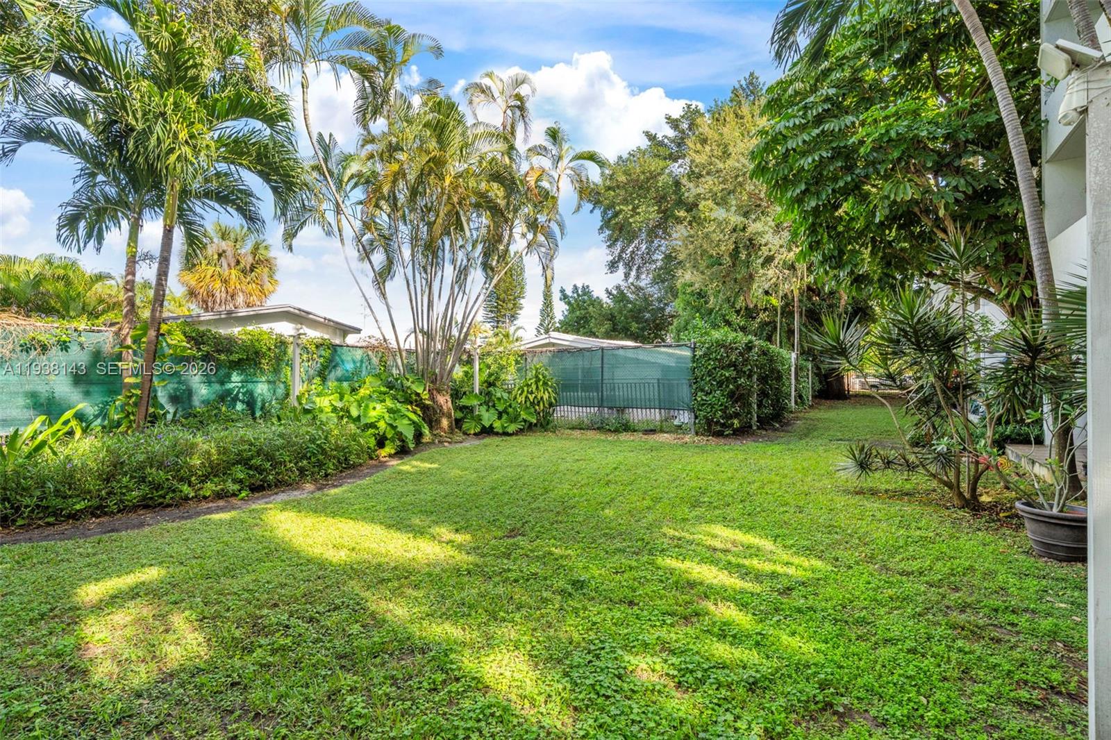 2150 Southwest 16th Avenue, Unit 402 Miami, FL 33145 - Photo 23 of 25 a view of a backyard with a garden