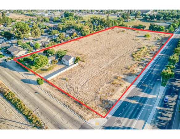 a view of a wooden floor with a small yard