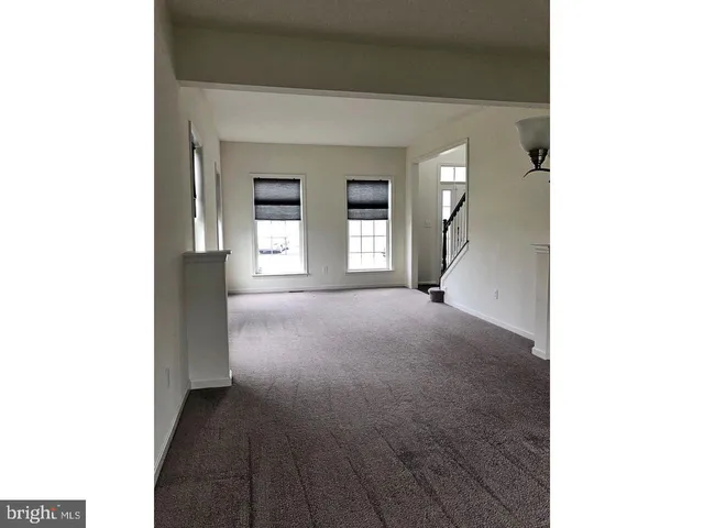 a kitchen with kitchen island a sink stainless steel appliances and cabinets