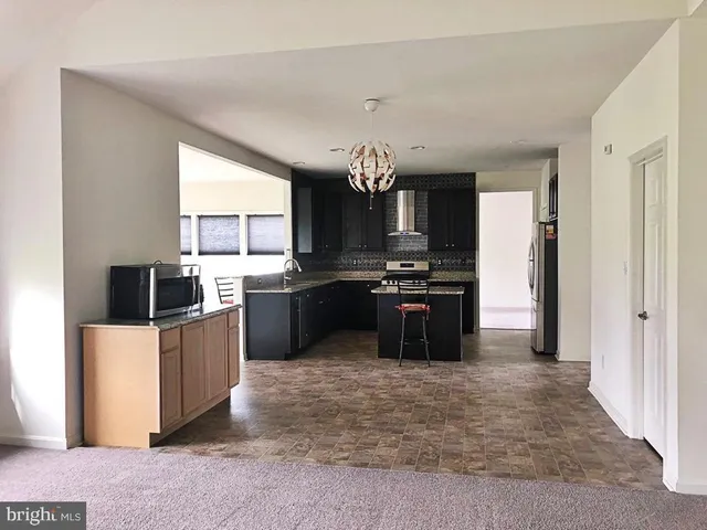 a bedroom with a bed and a fireplace