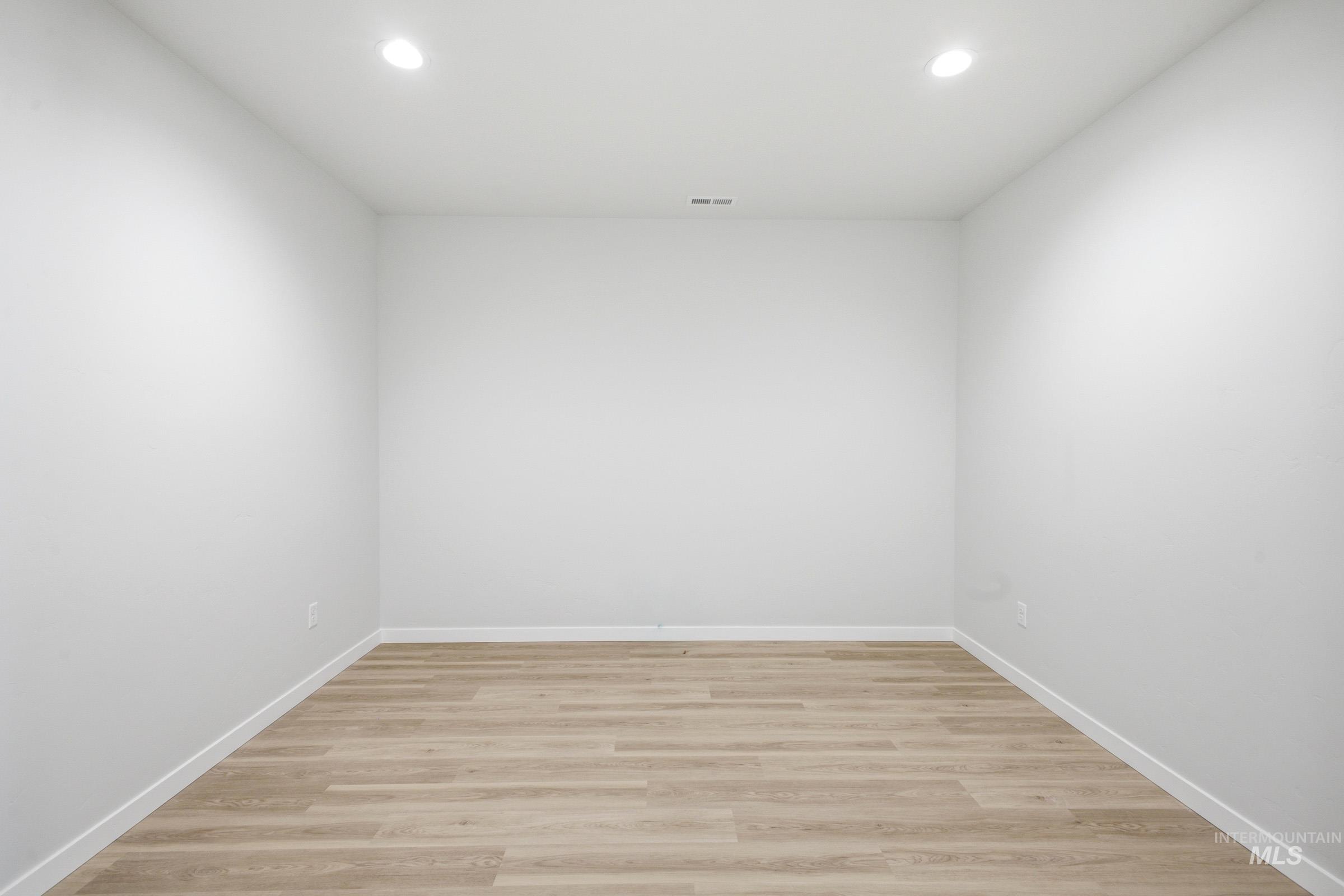 13633 Redway Court Caldwell, ID 83607 - Photo 14 of 29 Unfurnished room with light wood-type flooring and recessed lighting
