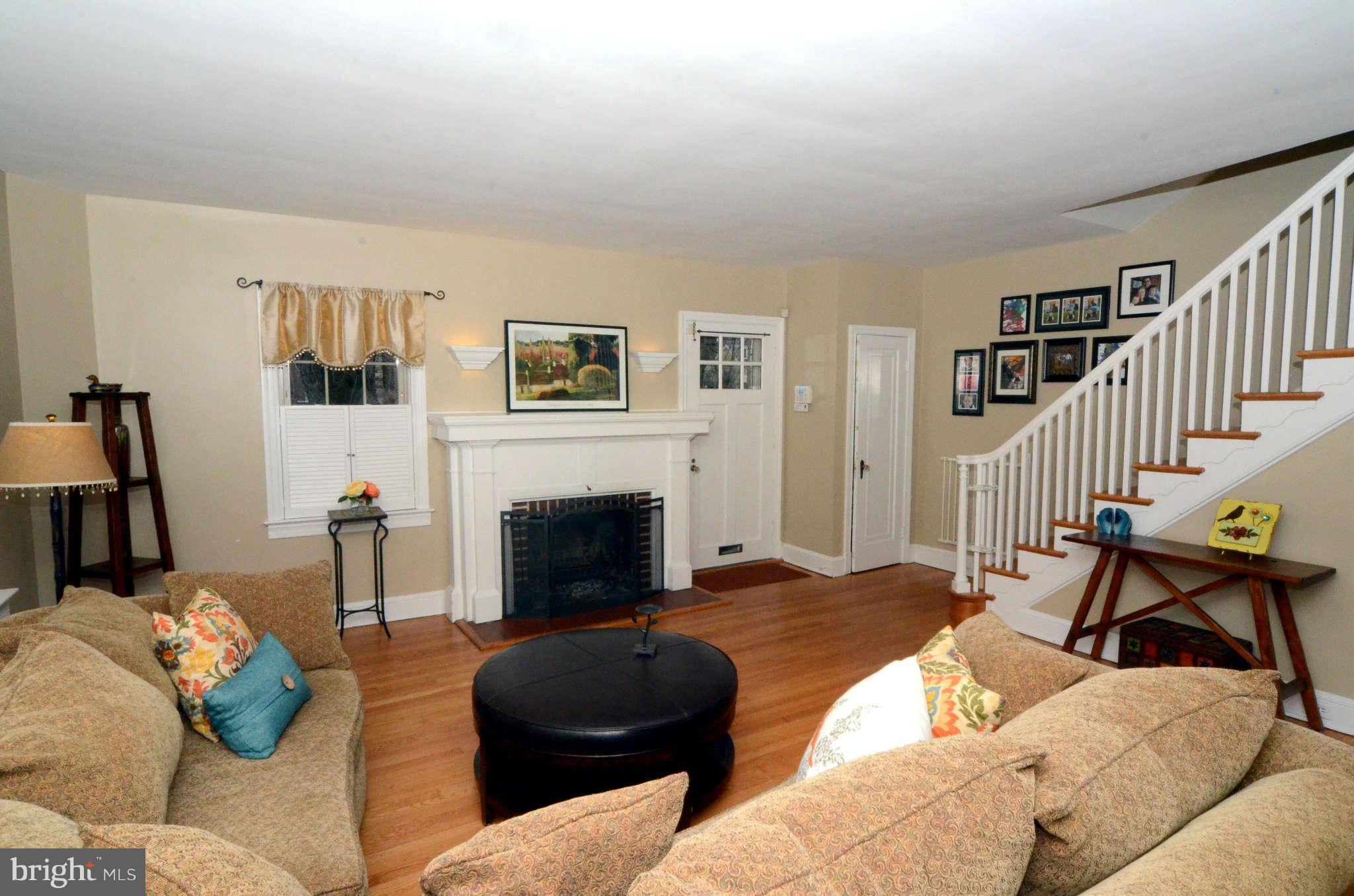 426 Hopkins Road Baltimore, MD 21212 - Photo 3 of 30 a living room with furniture and a fireplace