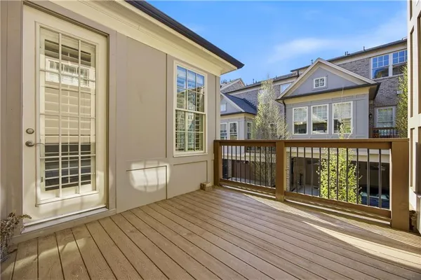 a view of a house with wooden deck