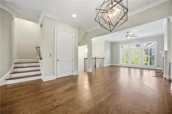 a view of an entryway with wooden floors