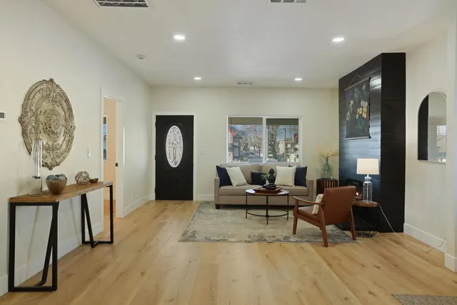 a living room with furniture and a fireplace