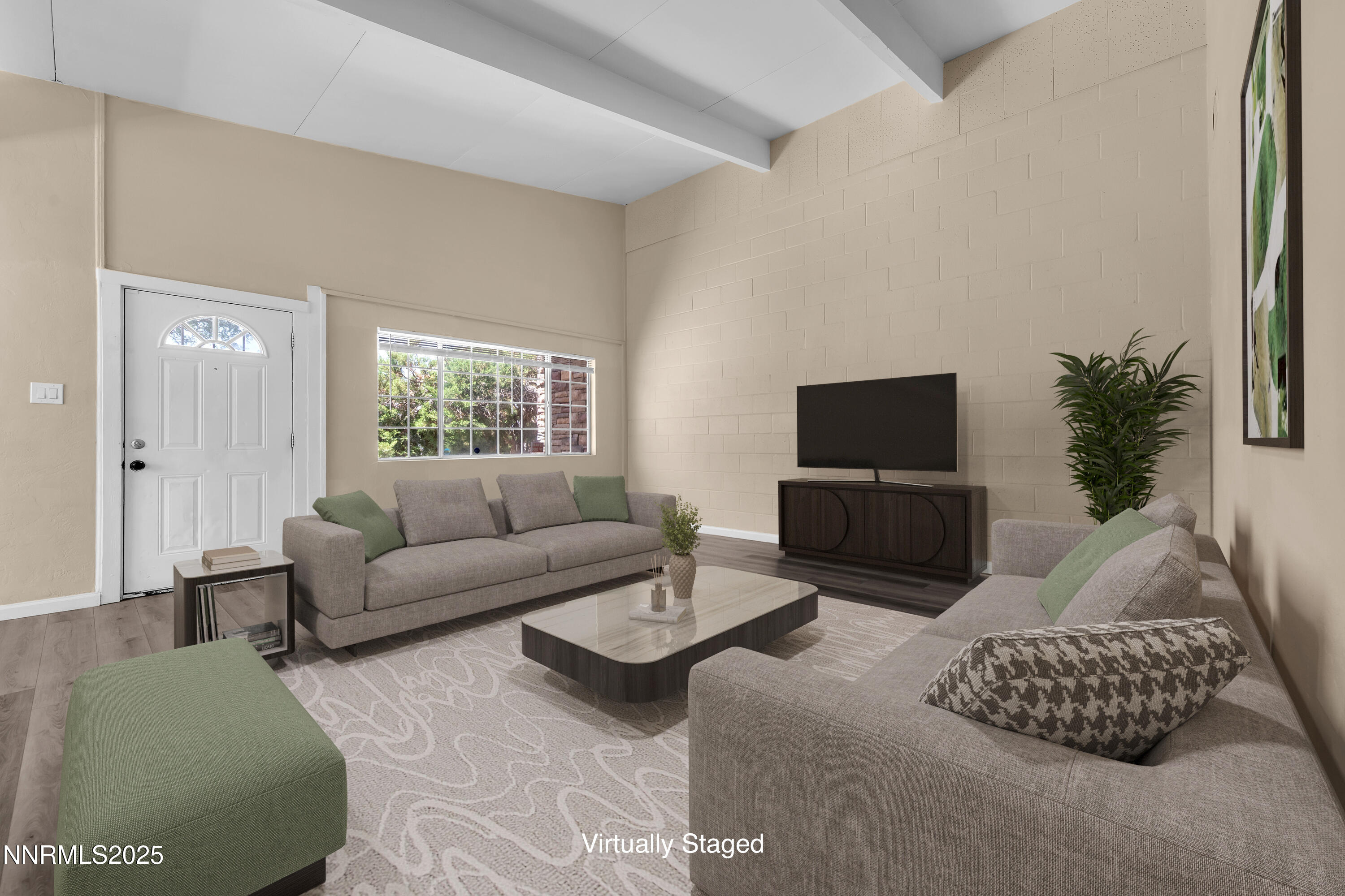 a living room with furniture and a flat screen tv