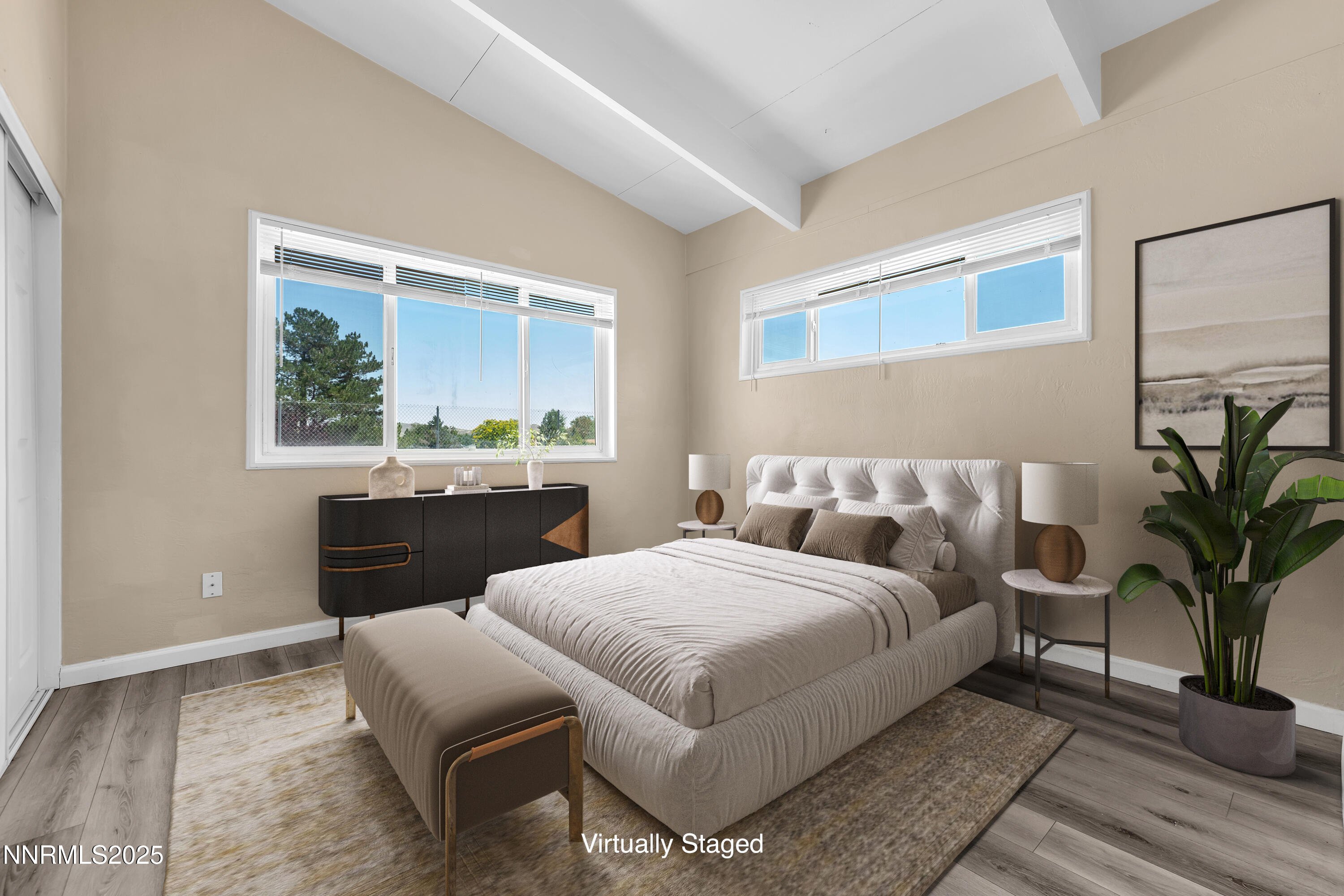 12190 Rocky Mountain Street Reno, NV 89506 - Photo 13 of 27 a bedroom with a large bed and a window