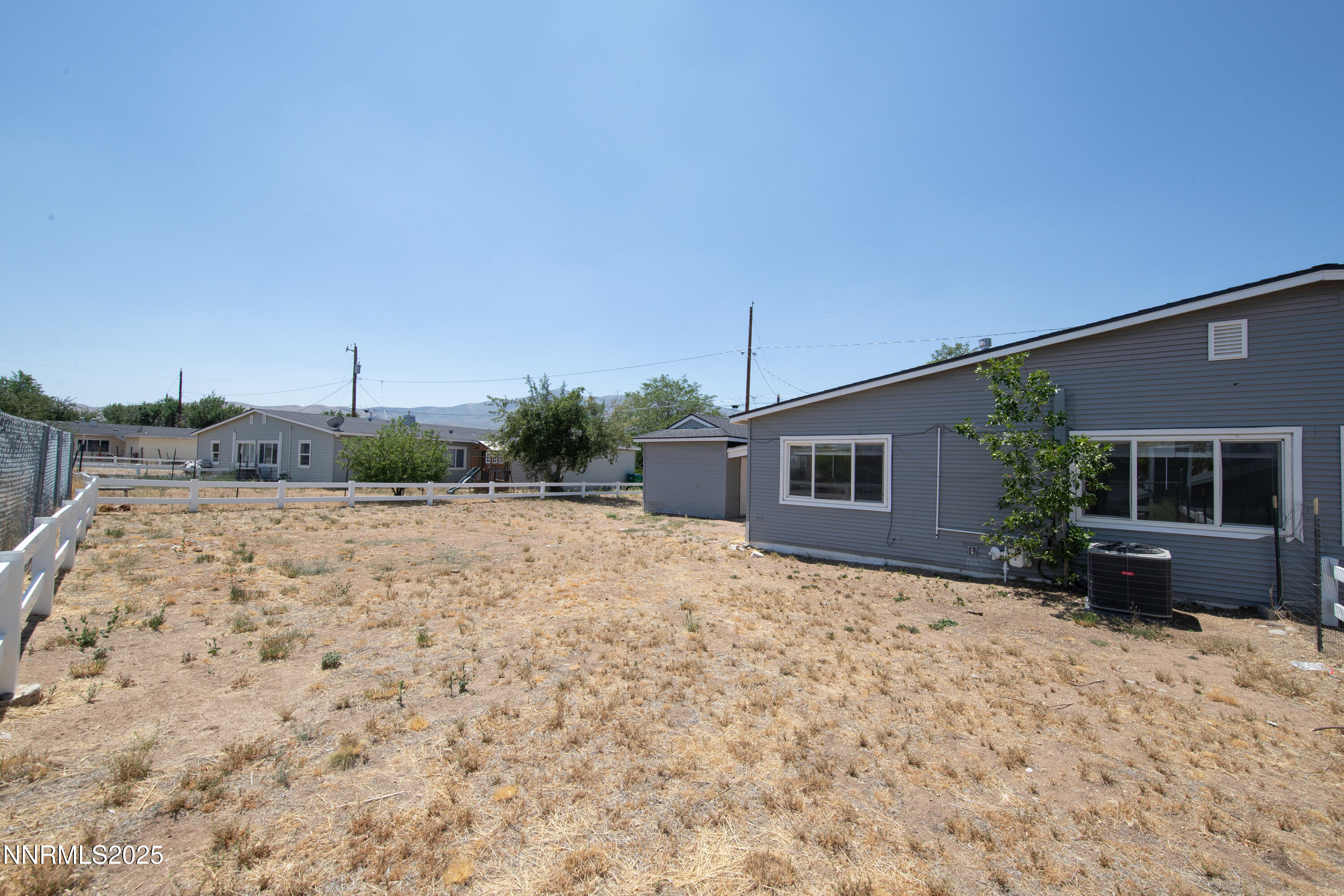 12190 Rocky Mountain Street Reno, NV 89506 - Photo 15 of 27 a house view with a outdoor space