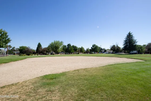 a view of street with parked cars