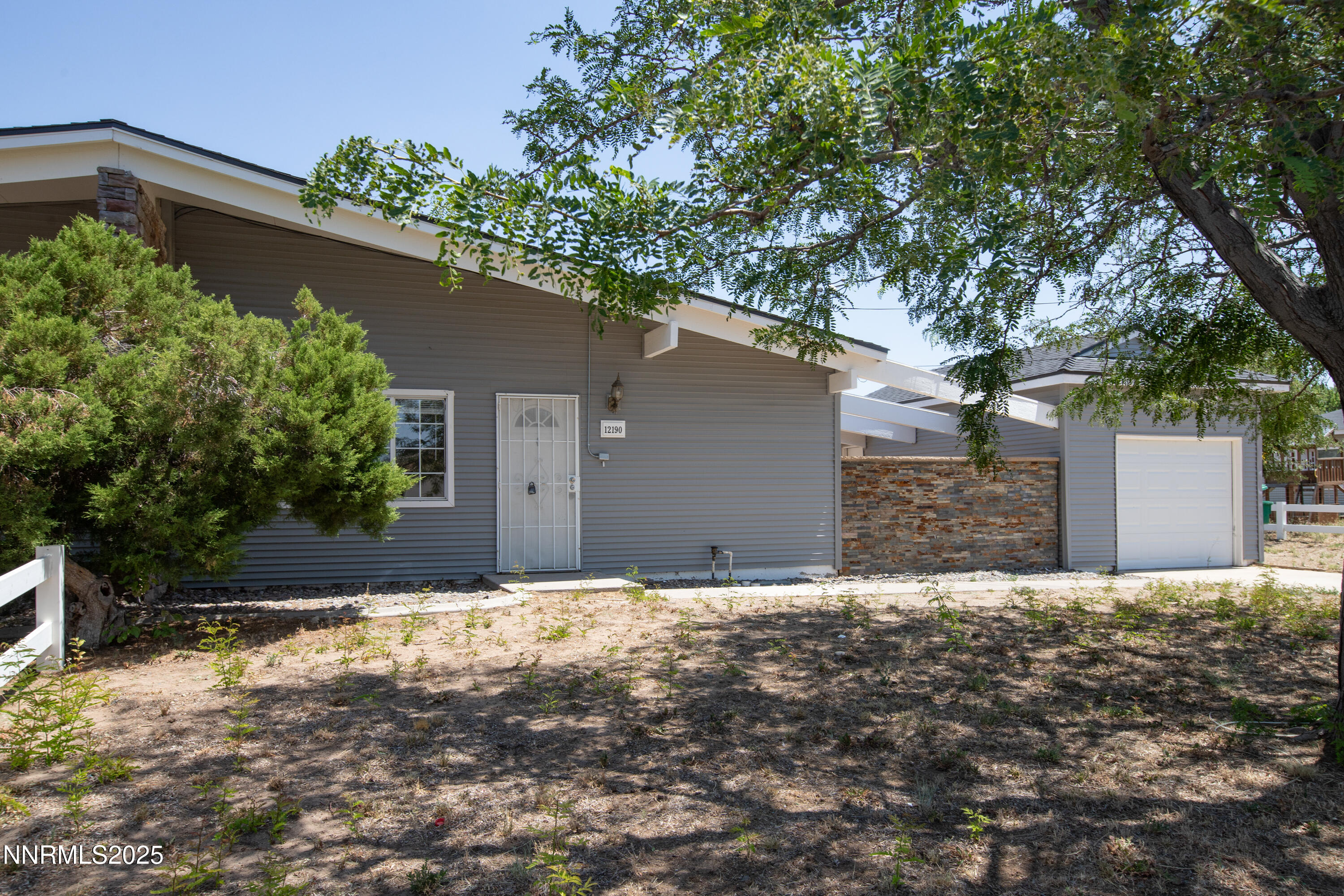 12190 Rocky Mountain Street Reno, NV 89506 - Photo 3 of 27 front view of a house with a yard