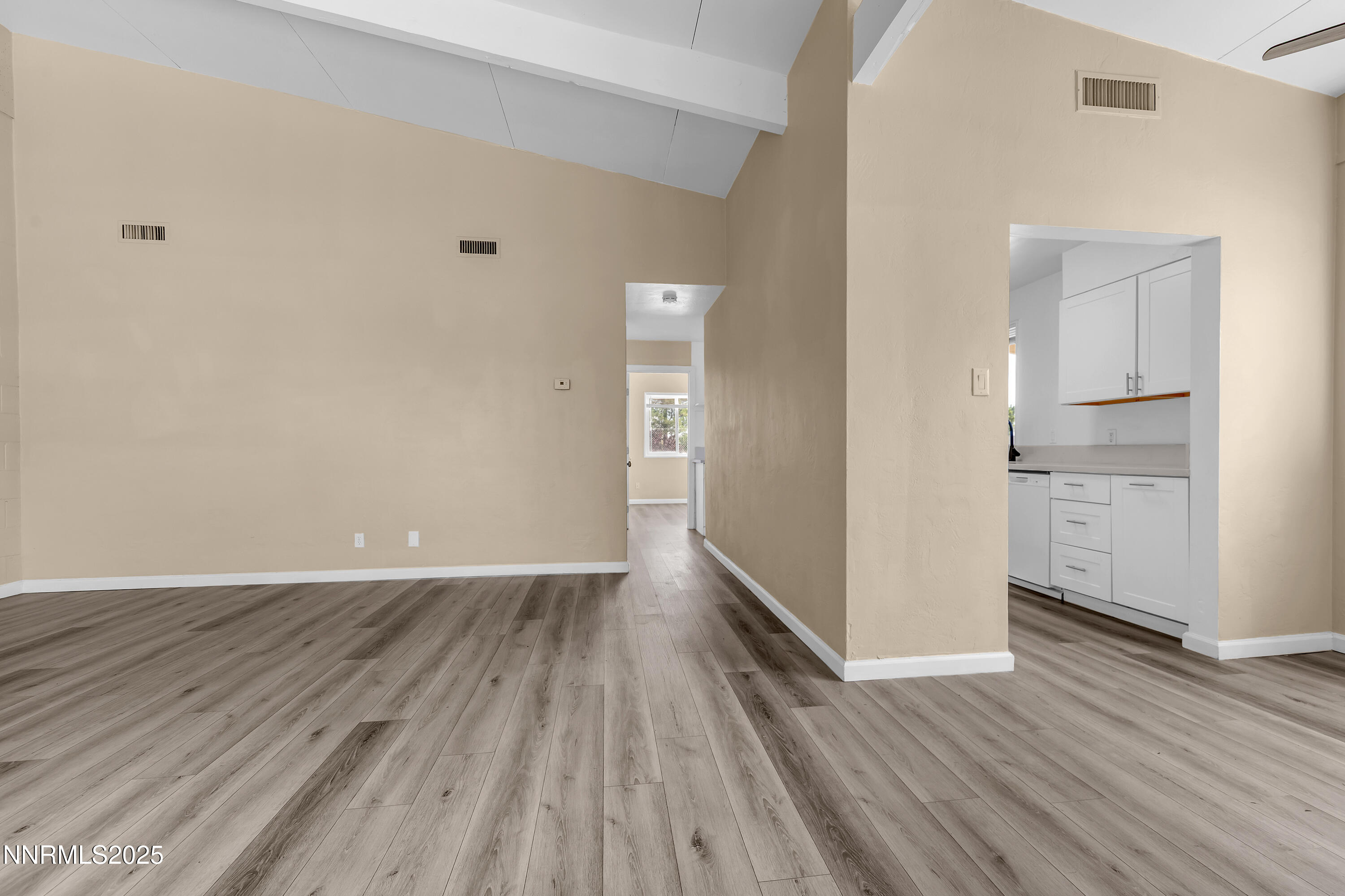 12190 Rocky Mountain Street Reno, NV 89506 - Photo 7 of 27 wooden floor in an empty room with a window