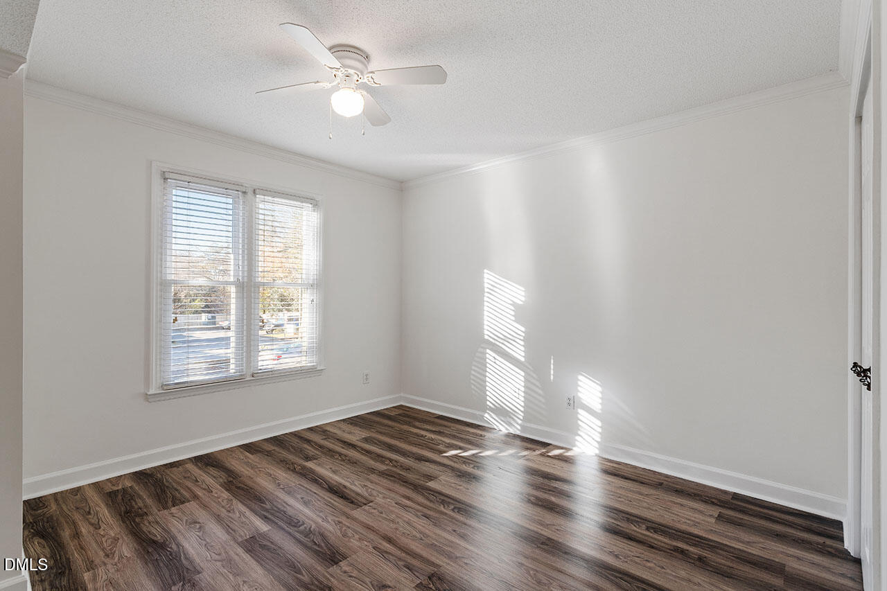 2306 Stafford Avenue, Unit D Raleigh, NC 27607 - Photo 16 of 24 wooden floor in an empty room with a window