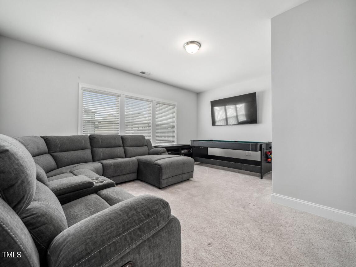 2609 Princess Tree Drive Raleigh, NC 27616 - Photo 13 of 23 a living room with furniture and a window