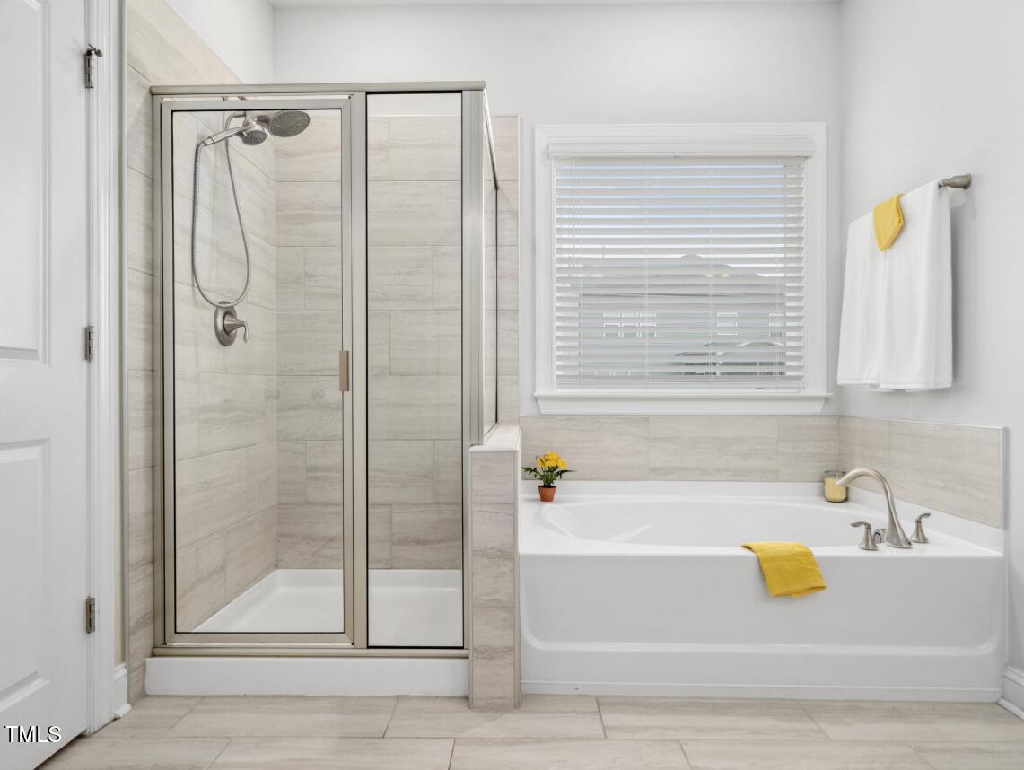 2609 Princess Tree Drive Raleigh, NC 27616 - Photo 17 of 23 a bathroom with a shower and a bathtub