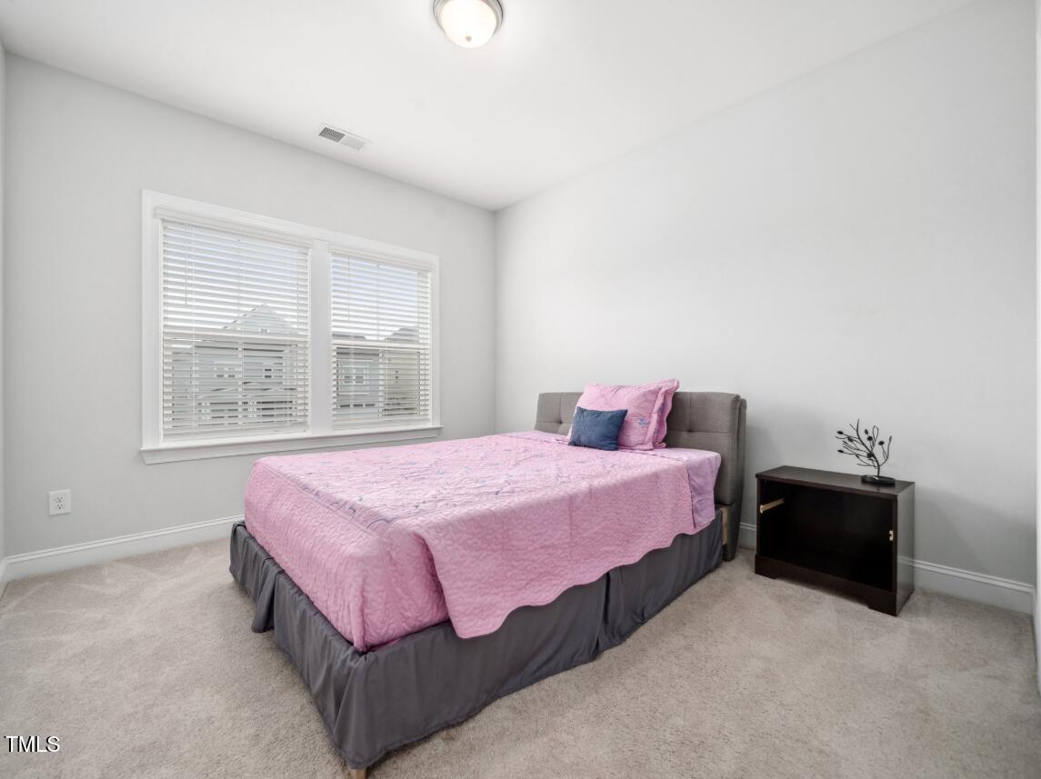 2609 Princess Tree Drive Raleigh, NC 27616 - Photo 19 of 23 a bedroom with a bed and window