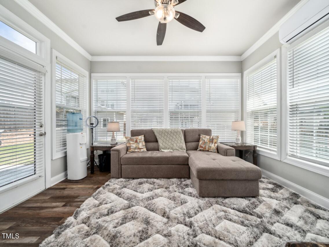 2609 Princess Tree Drive Raleigh, NC 27616 - Photo 21 of 23 a living room with furniture and a large window