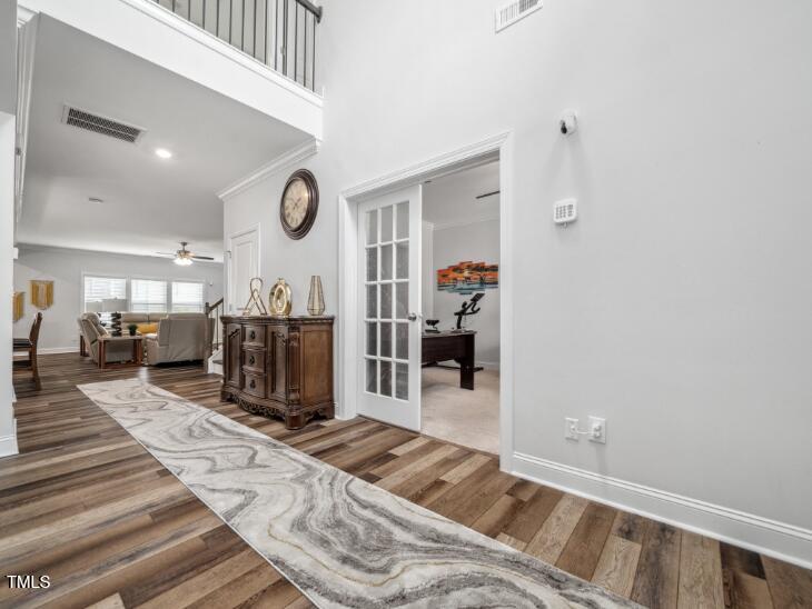 2609 Princess Tree Drive Raleigh, NC 27616 - Photo 3 of 23 a living room with furniture a rug and gym equipment