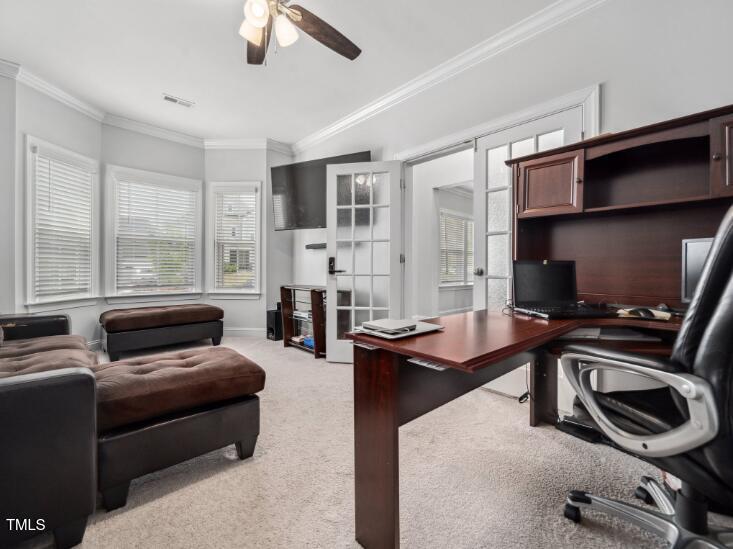 2609 Princess Tree Drive Raleigh, NC 27616 - Photo 4 of 23 a living room with furniture and a flat screen tv