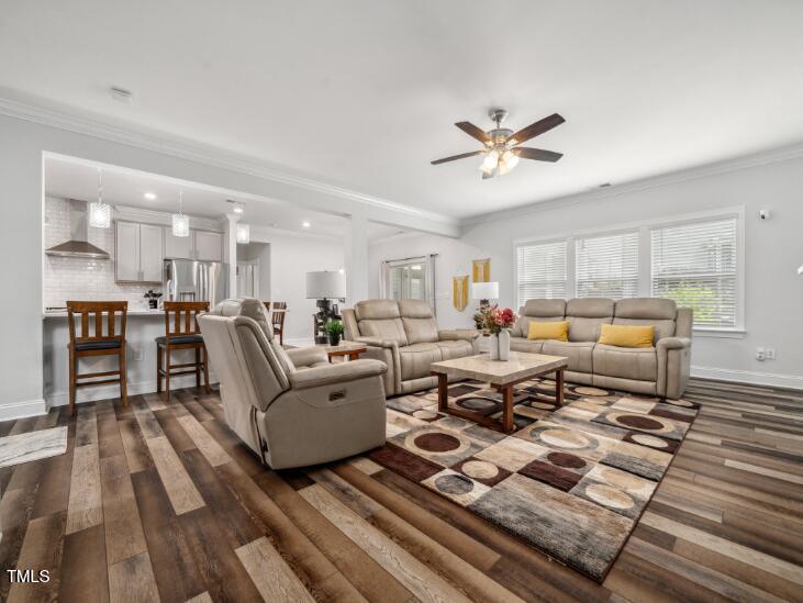 2609 Princess Tree Drive Raleigh, NC 27616 - Photo 5 of 23 a living room with furniture kitchen view and a wooden floor