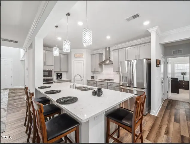 a kitchen with a dining table and chairs