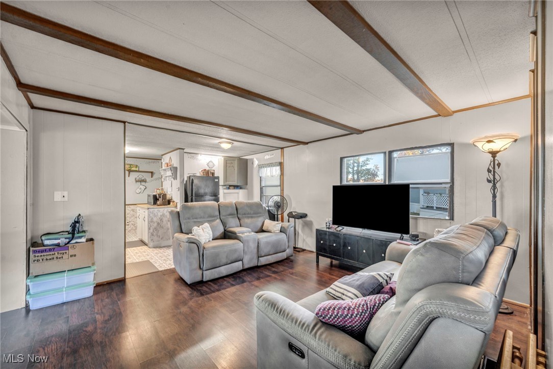 35157 Center Ridge Road, Unit 126 North Ridgeville, OH 44039 - Photo 23 of 50 Living area with wood finished floors and beamed ceiling