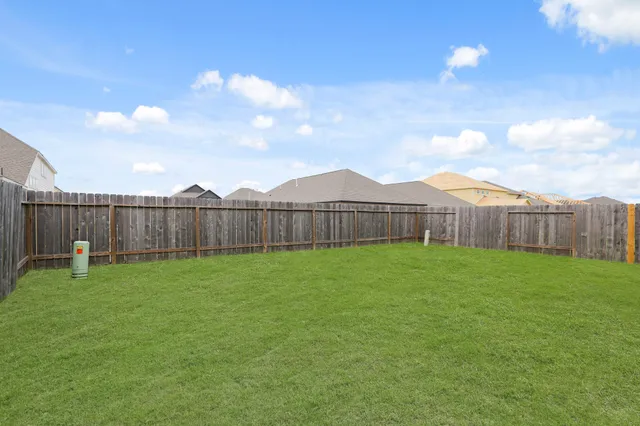 a view of a backyard with green space