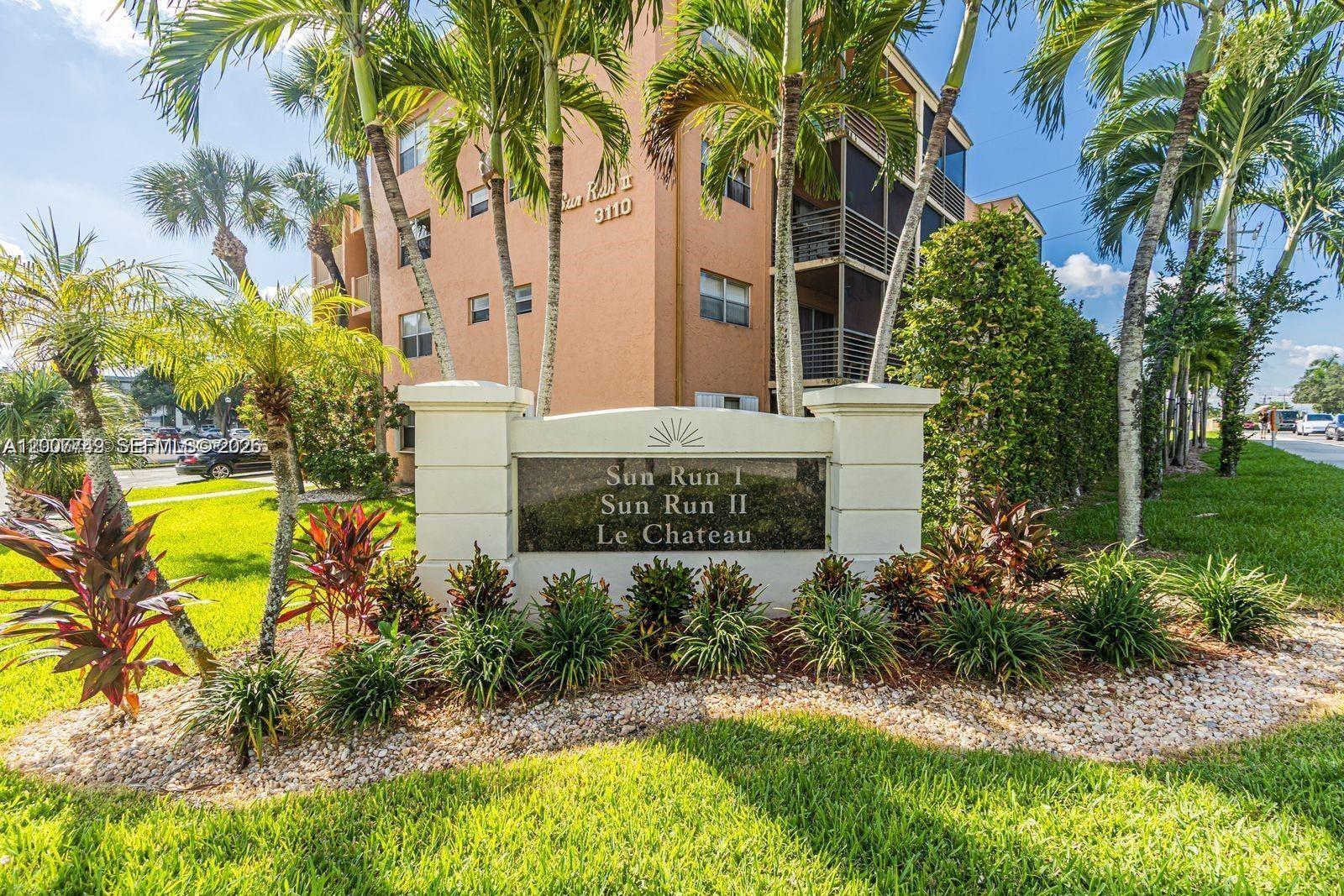 3120 North Pine Island Road, Unit 307 Sunrise, FL 33351 - Photo 15 of 16 a view of a house with a palm trees