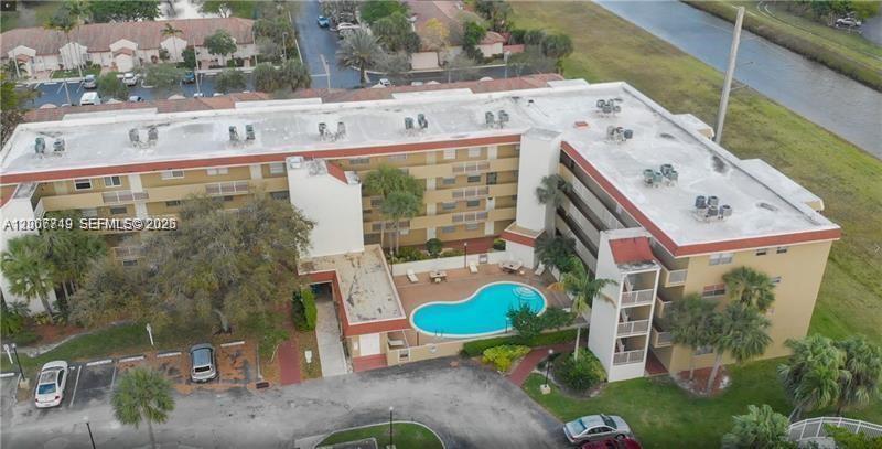3120 North Pine Island Road, Unit 307 Sunrise, FL 33351 - Photo 16 of 16 an aerial view of a house with swimming pool