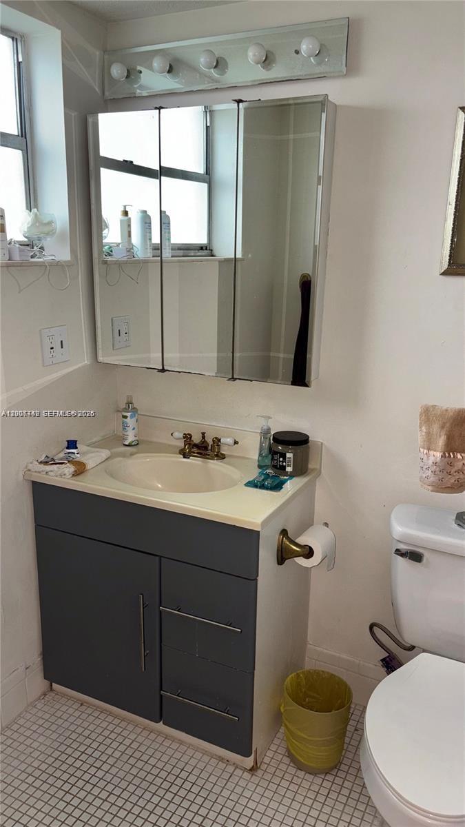 3120 North Pine Island Road, Unit 307 Sunrise, FL 33351 - Photo 6 of 16 a bathroom with a sink and a mirror