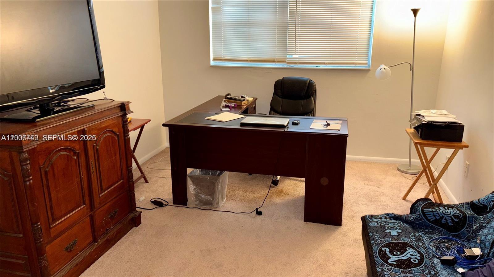 3120 North Pine Island Road, Unit 307 Sunrise, FL 33351 - Photo 7 of 16 a room with furniture and a mirror