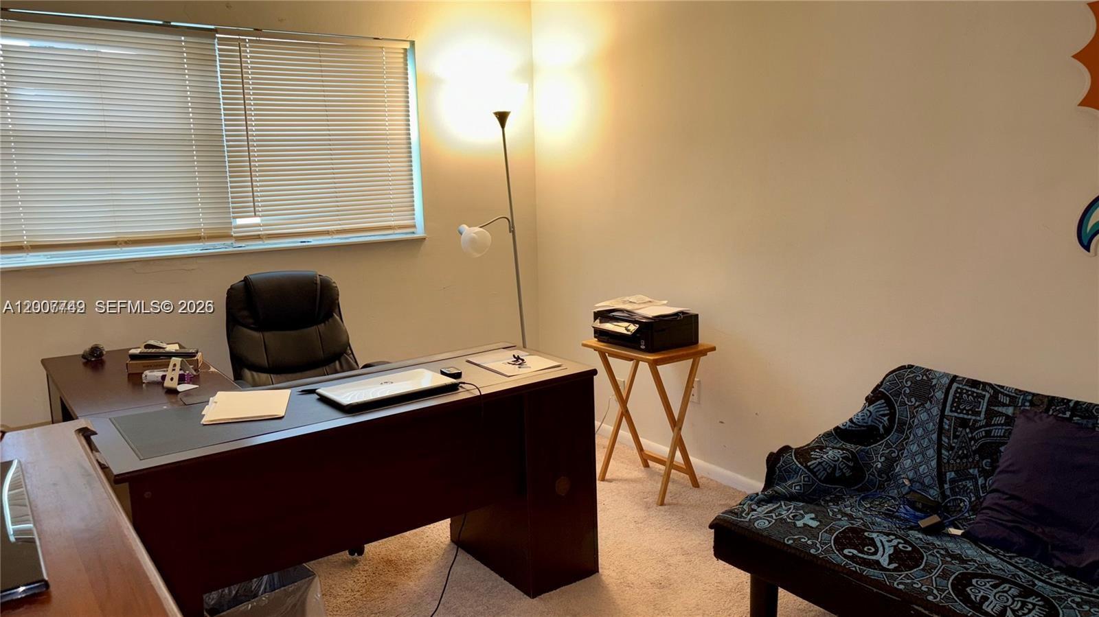 3120 North Pine Island Road, Unit 307 Sunrise, FL 33351 - Photo 9 of 16 a living room with furniture and a wooden floor