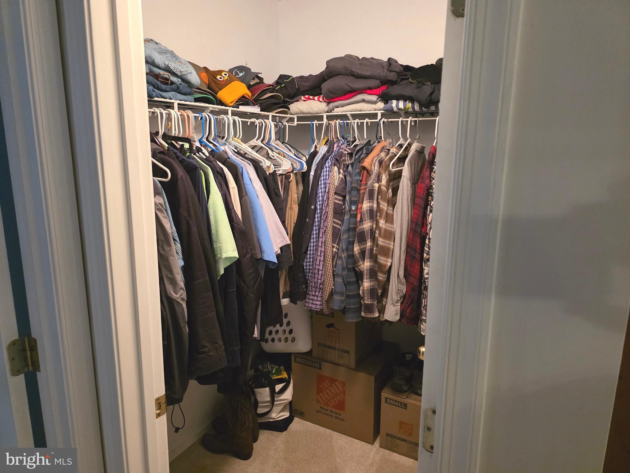 2441 Kemper Road Crofton, MD 21114 - Photo 44 of 63 a view of walk in closet with clothes