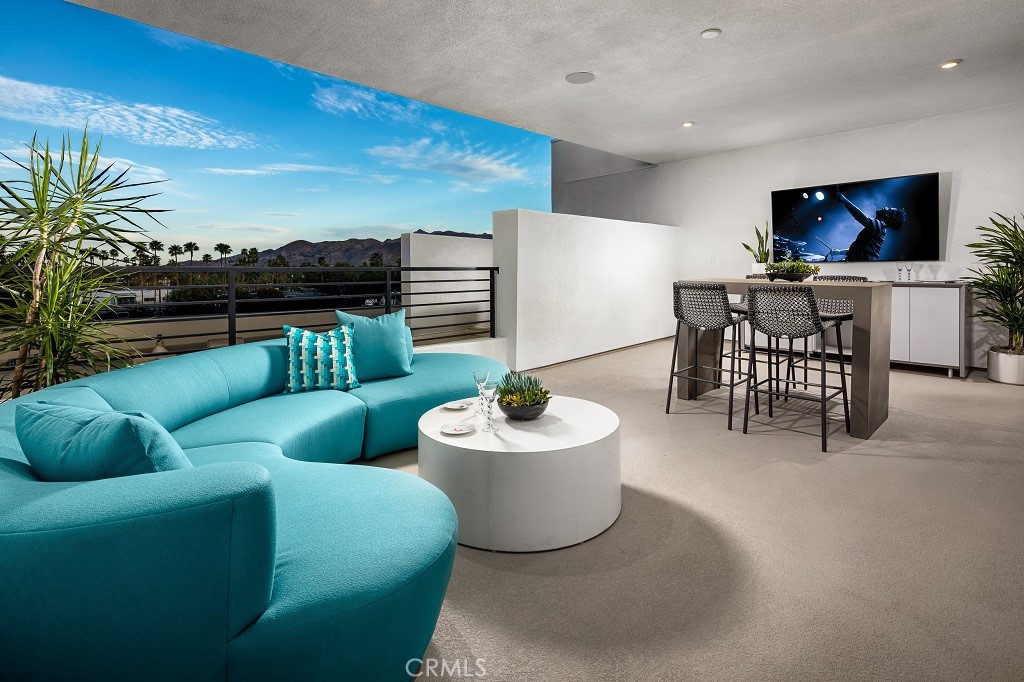 438 Huddle Spgs Way Palm Springs, CA 92264 - Photo 11 of 11 a living room with furniture and a flat screen tv