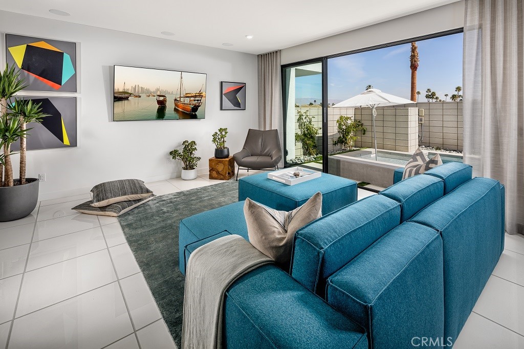 438 Huddle Spgs Way Palm Springs, CA 92264 - Photo 5 of 11 a living room with furniture and a large window