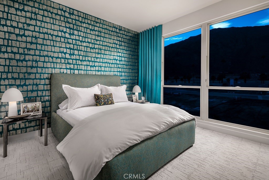 438 Huddle Spgs Way Palm Springs, CA 92264 - Photo 9 of 11 a bedroom with a bed and a lamp on dresser